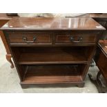 A small reproduction mahogany two shelf bookcase with two frieze drawers 77cm x 75cm high