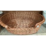 A large wicker dog basket