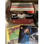 A red vinyl LP case containing approximately 35 LPs - mainly 70's including Status Quo,