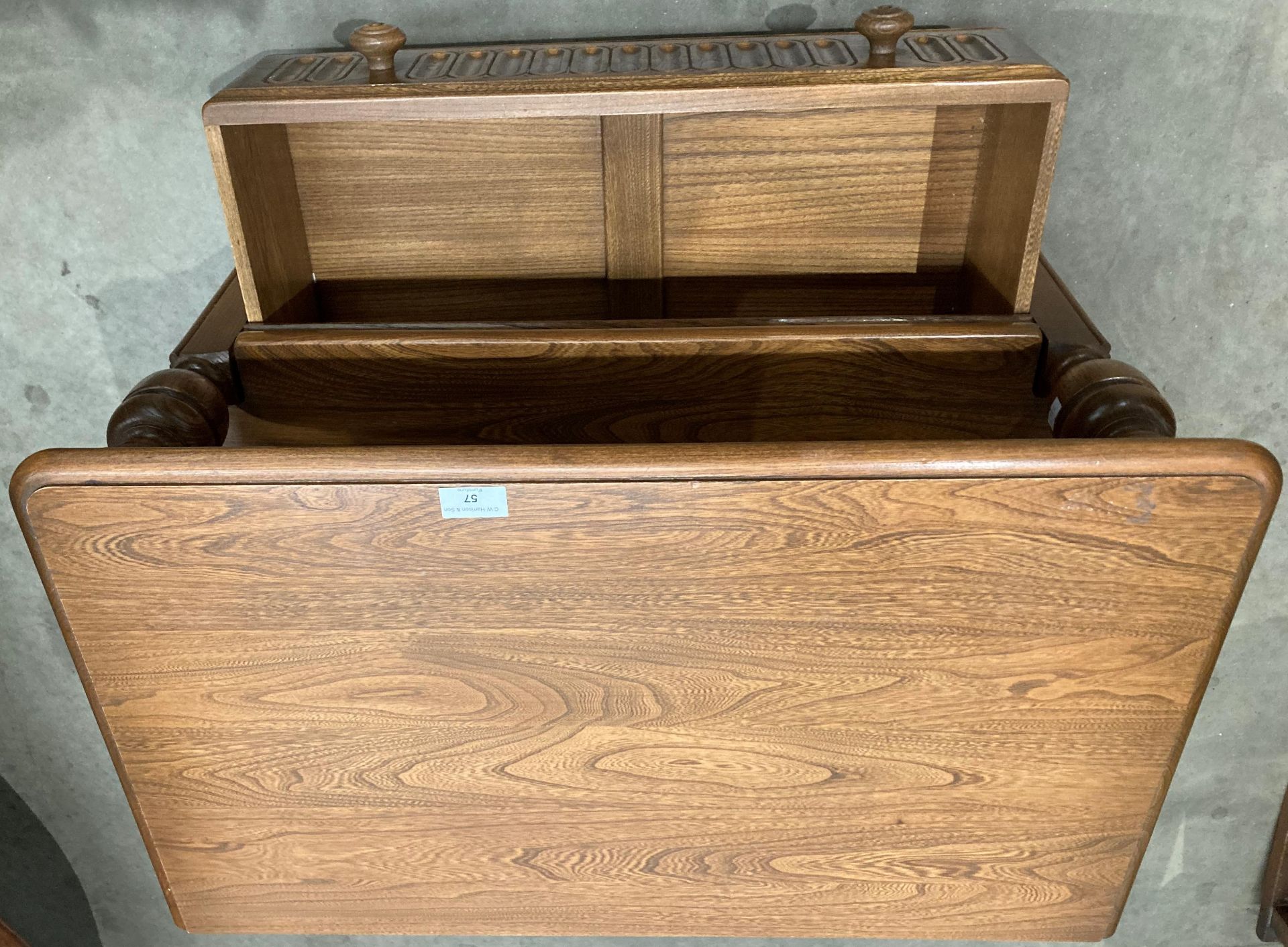 An Ercol medium elm entertainment stand with single drawer and lift top triangular back flap 72cm x - Image 4 of 4