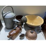 A glazed stoneware pancheon, galvanised watering can, copper jug,