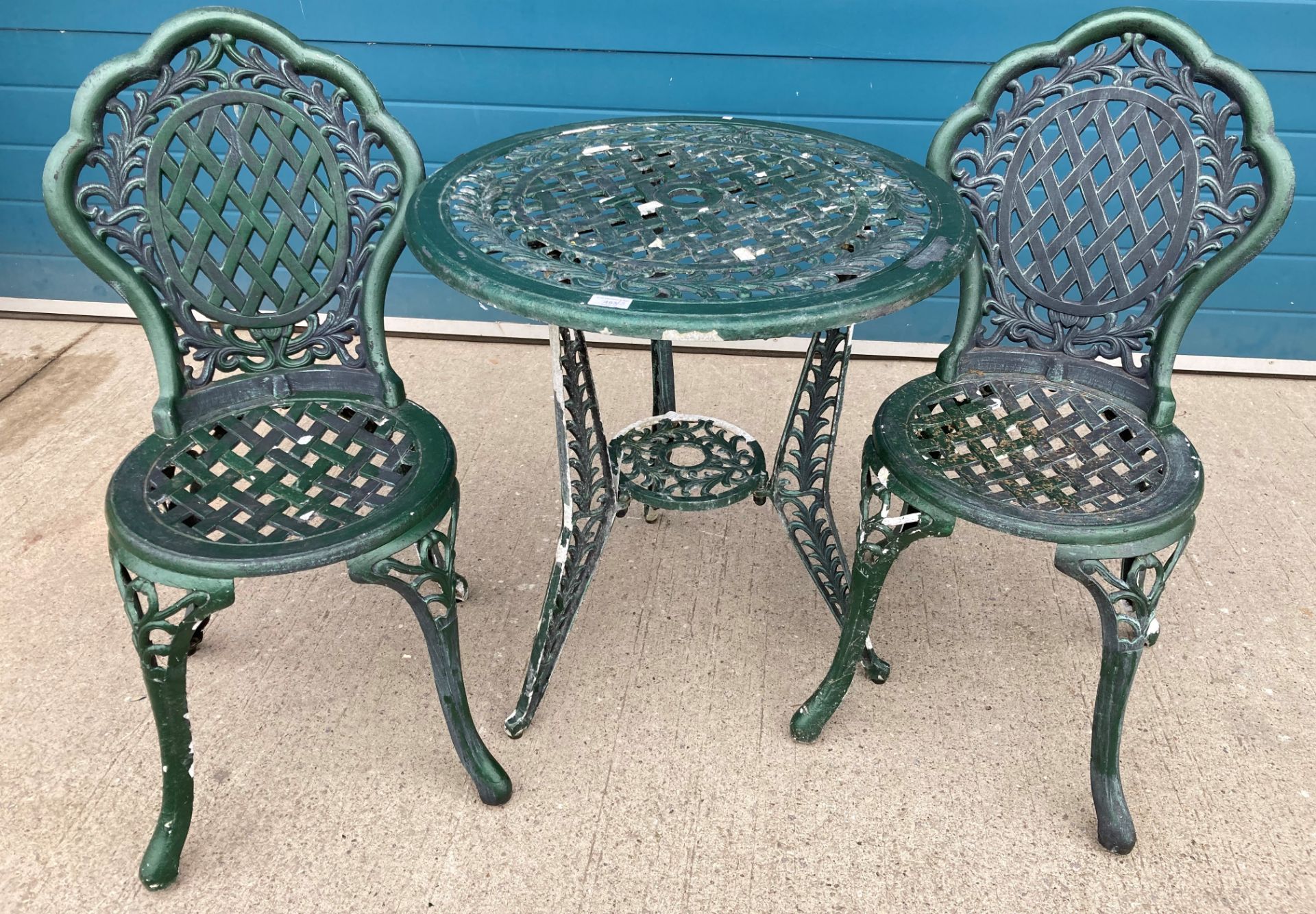 A green painted aluminium patio table,