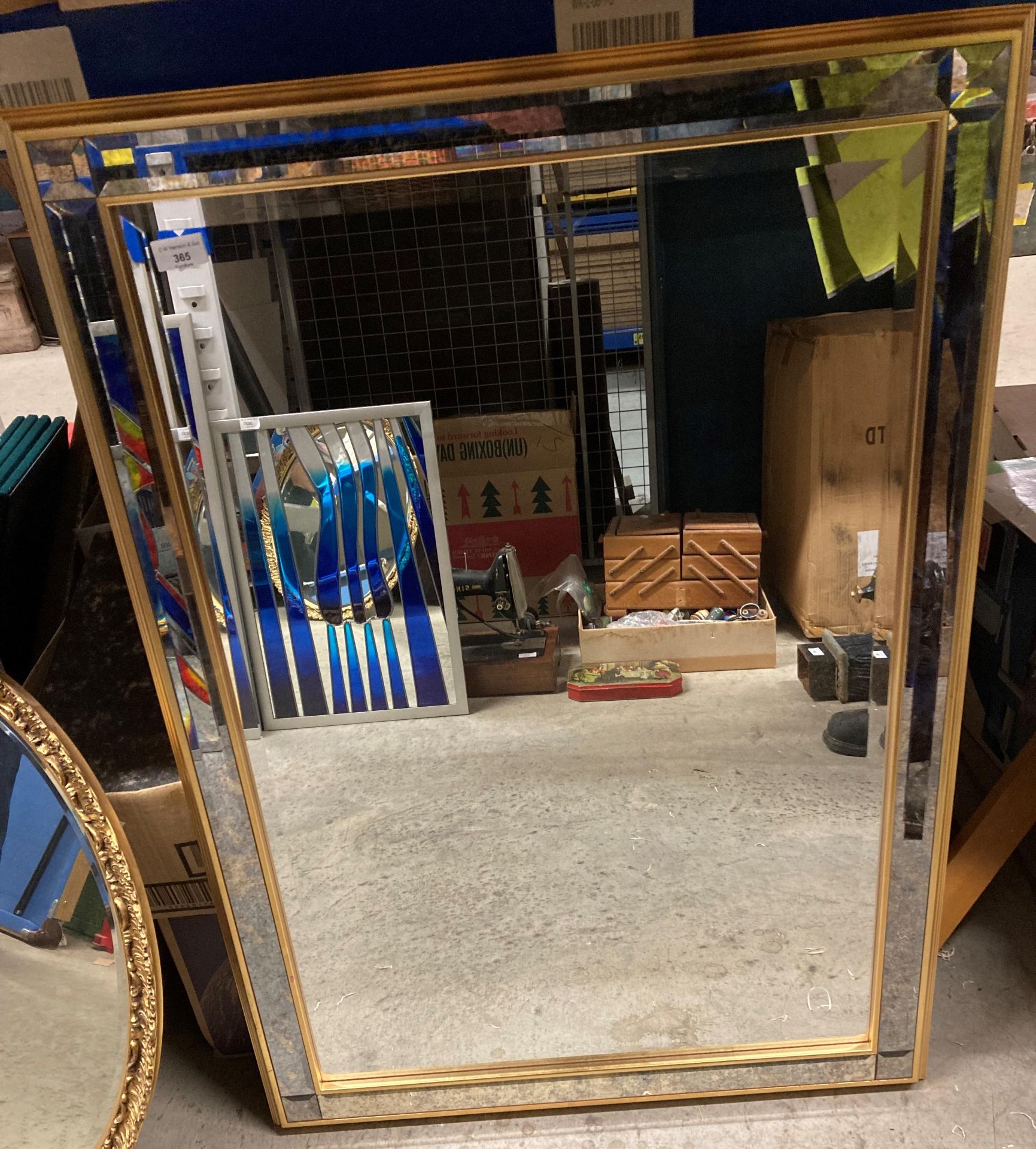 A gilt and mirrored framed wall mirror,