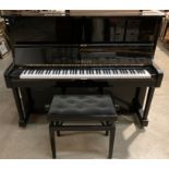 A Yamaha iron framed upright piano 148cm in ebonised case, model U1 s/no 2252977.