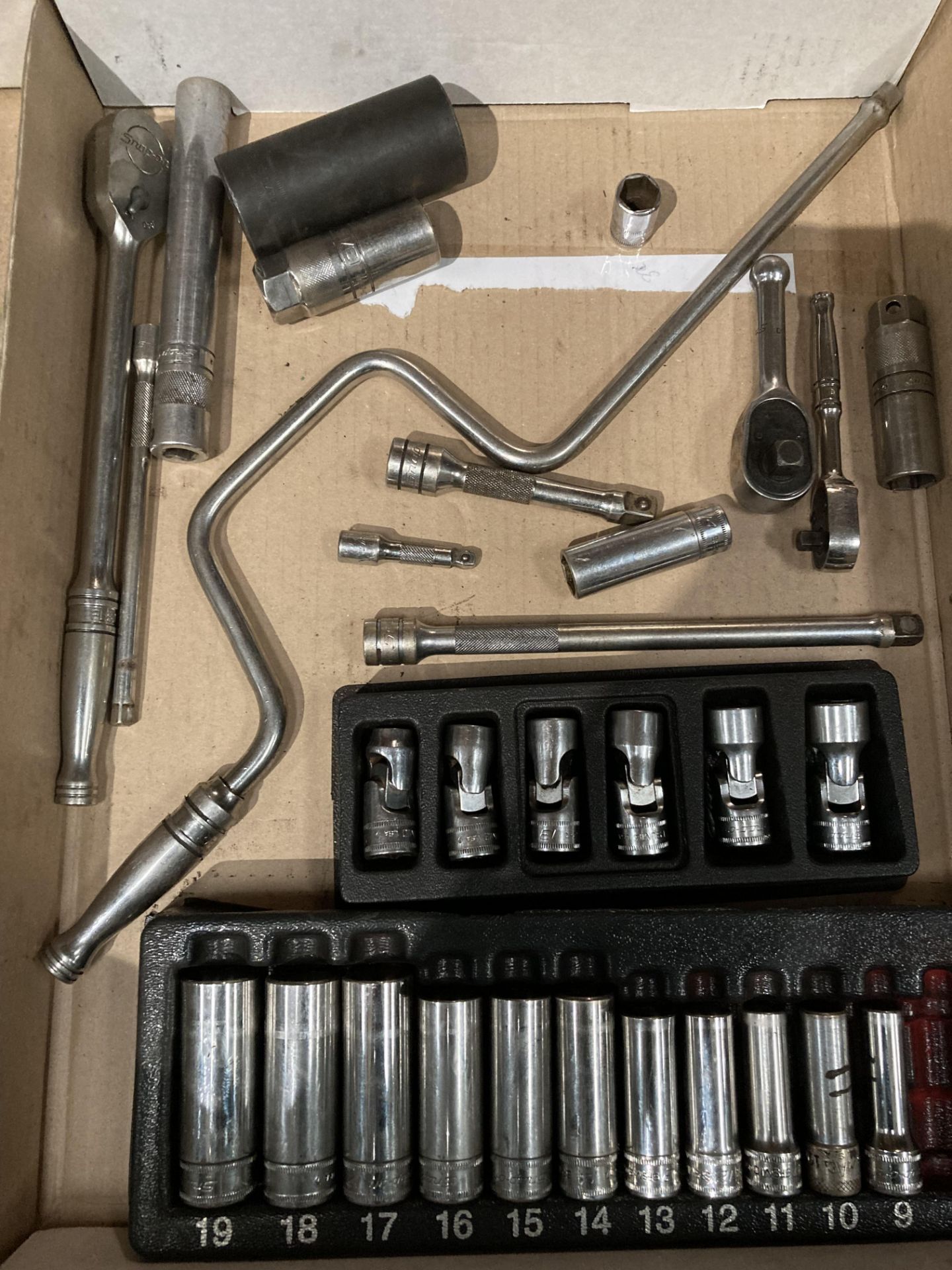 31 assorted pieces of Snap-on sockets, wrenches, extender's etc.