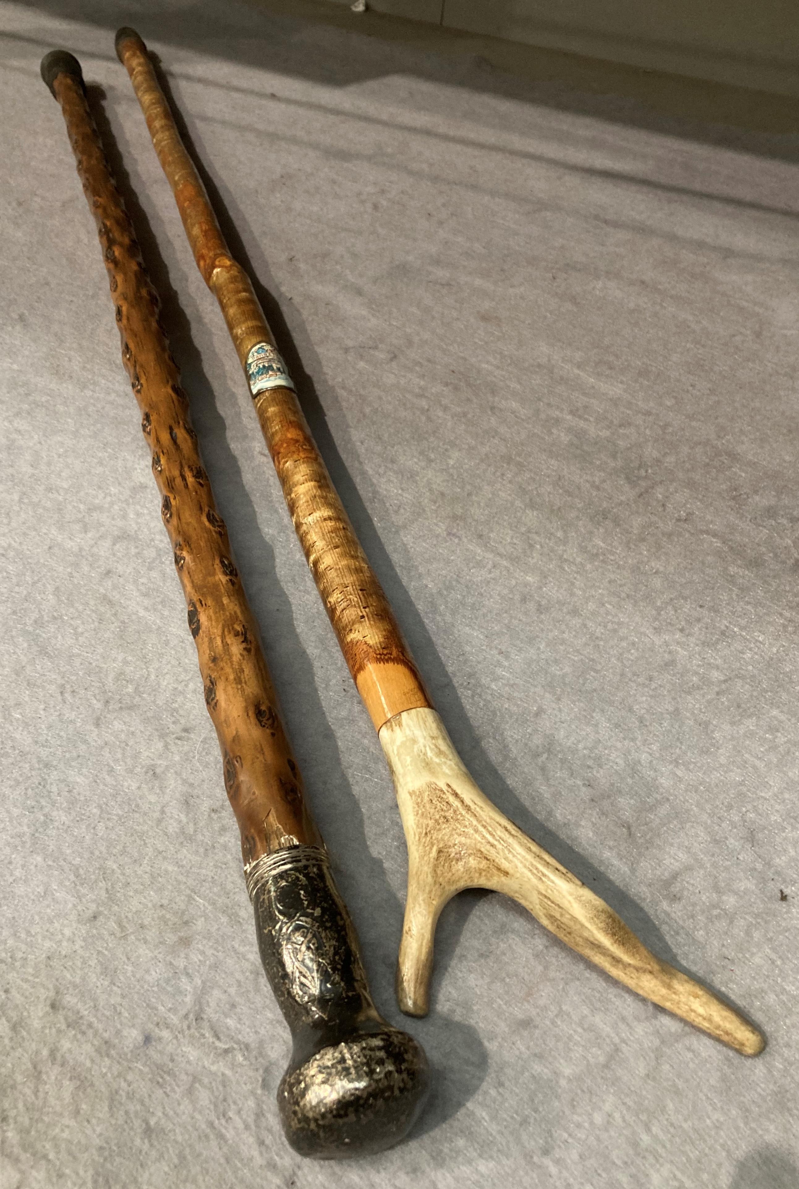 A wood walking stick with silver mount 86cm and another with a horn handle 94cm