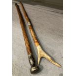A wood walking stick with silver mount 86cm and another with a horn handle 94cm
