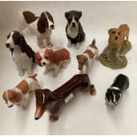A collection of nine various moulded and ceramic dogs - Spaniels, Labrador, Boxer etc by Beswick,