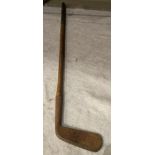 A wood handled putter by R Forgan and Sons,