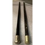 Two ebonised walking sticks (hollow interior) with silver coloured handles one inscribed 'J.