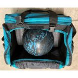 A black and blue patterned ten pin bowling ball in a Vantage USA fabric bag