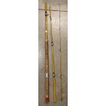 A three piece early carbon fibre fishing rod approximately 12' long