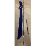 A Daiwa Sea Hunter Popular 4377-50 50lb two piece fishing rod approximately 5'2" complete with blue