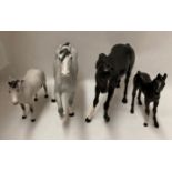 A black Beswick horse (missing part of ear) a Beswick black foal and two Beswick dapple grey horses