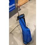 A blue canvas golf bag containing three various woods - Slazenger Ben Hogan,