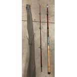 A Fulmar cane two piece fishing rod approximately 8'6" complete with Shakespeare brown canvas bag
