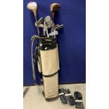 Contents to golf bag - seven assorted irons,