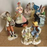 Five figurines including young couple with flower basket marked MR, gentleman with flower basket,