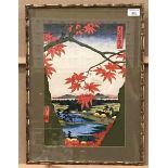 Coloured oriental print in bamboo effect frame, small village with mountains in the distance,