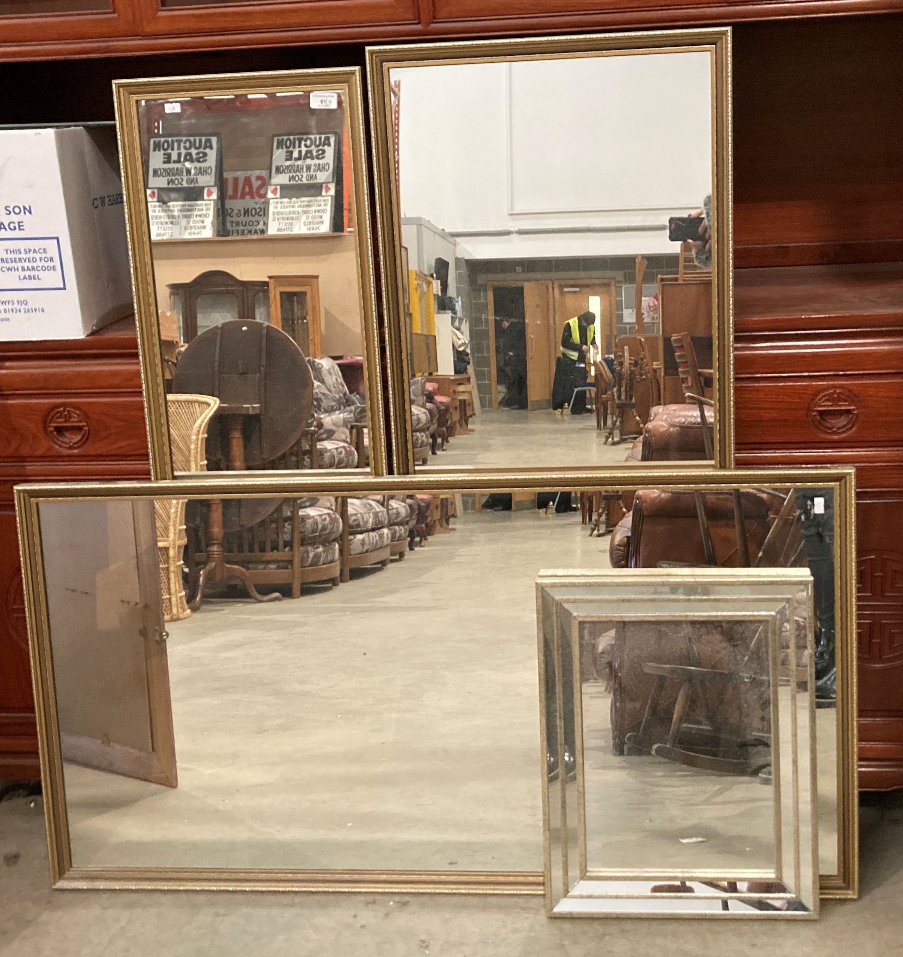 A large gilt framed wall mirror 66cm x 126cm,
