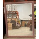 A large wood framed wall mirror,