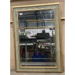 A large gilt framed wall mirror 106cm x 73cm
