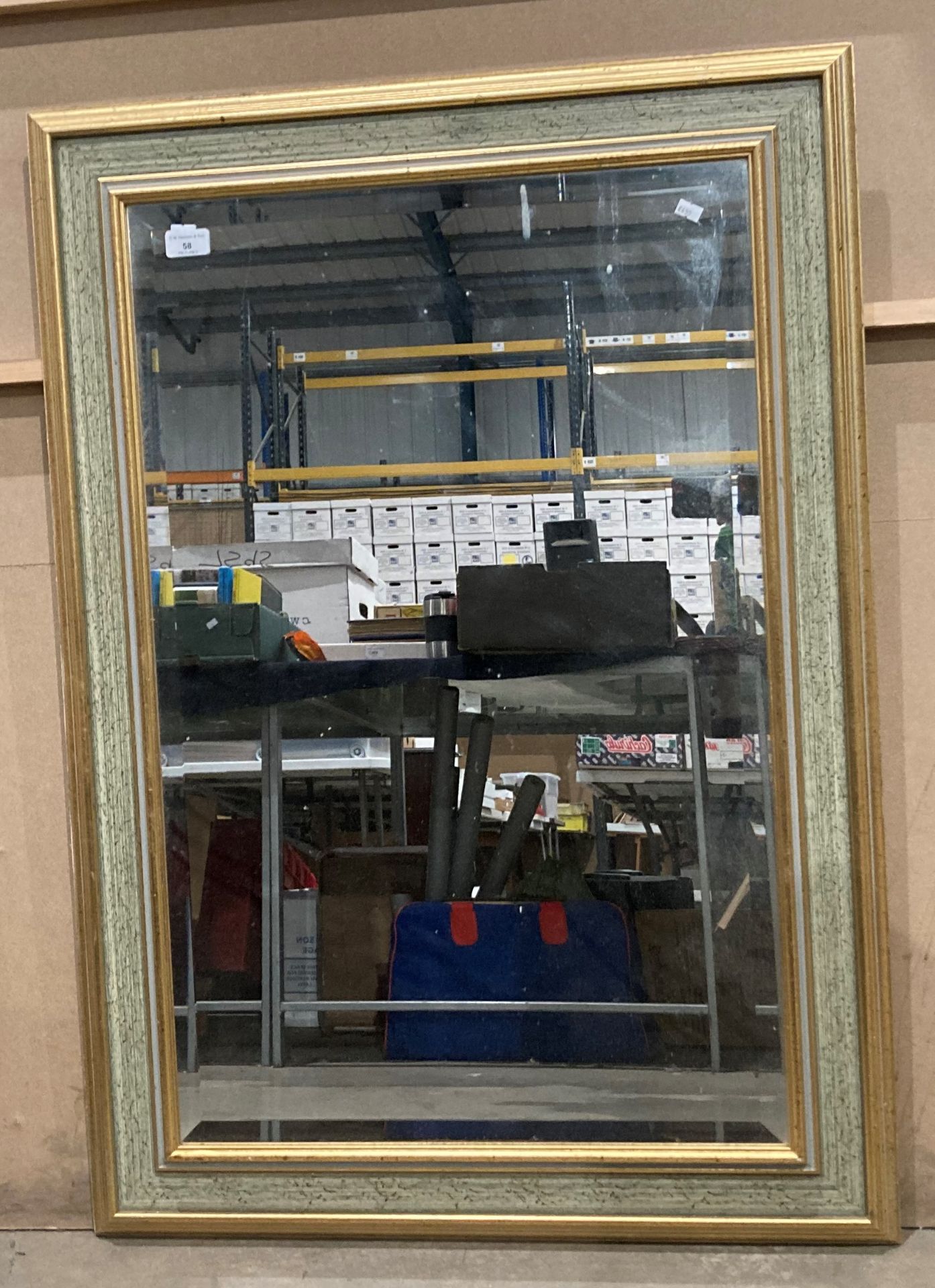 A large gilt framed wall mirror 106cm x 73cm