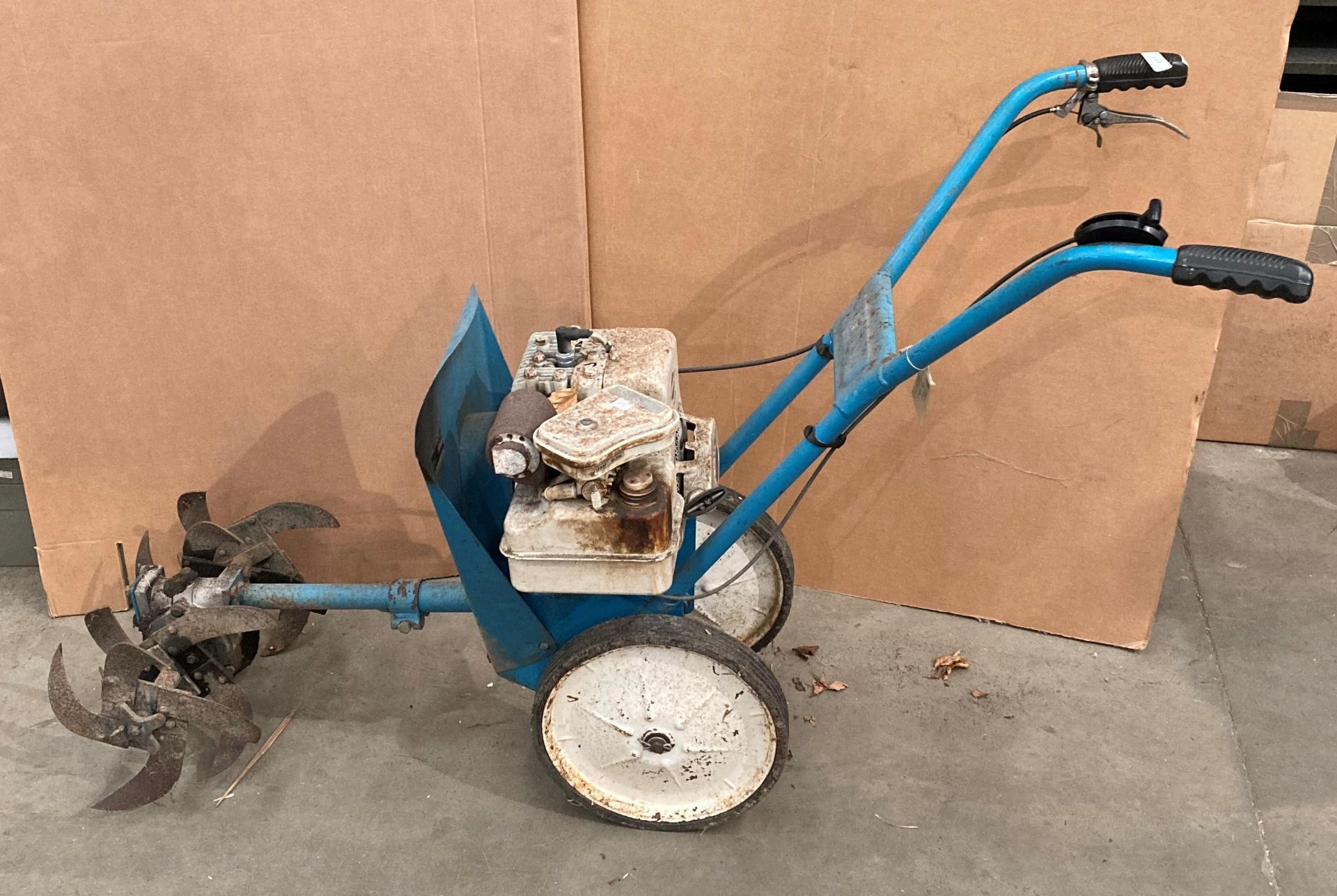 Landmaster super 88 petrol rotovator with a Briggs and Stratton 3hp 4 cycle engine (middle of