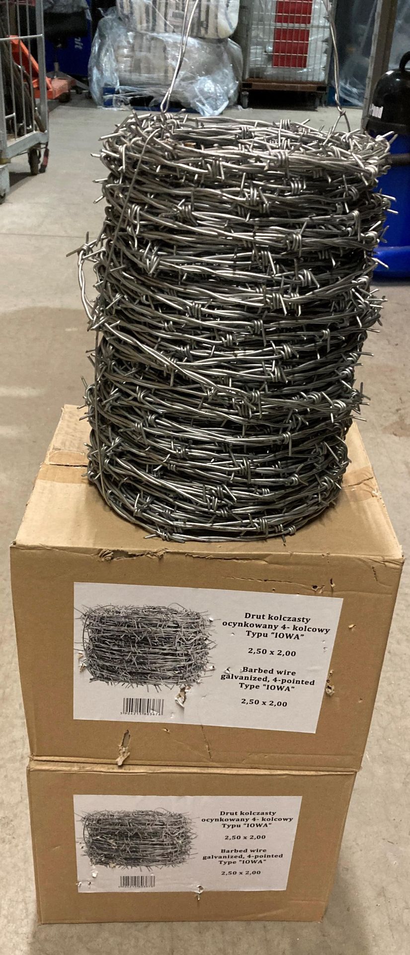 Three rolls of galvanised four pointed type "IOWA" barbed wire 2,50 x 2,