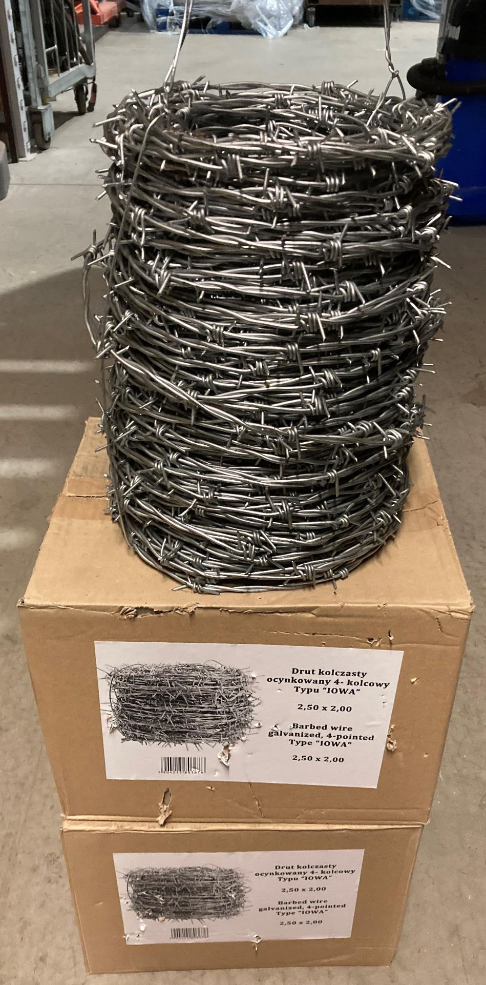 Three rolls of galvanised four pointed type "IOWA" barbed wire 2,50 x 2,