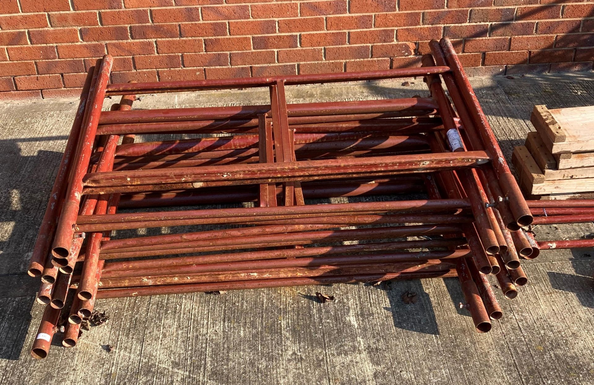 Red metal scaffolding tower including twelve frame sections 130cm x 100cm, four bars 185cm, - Image 2 of 3