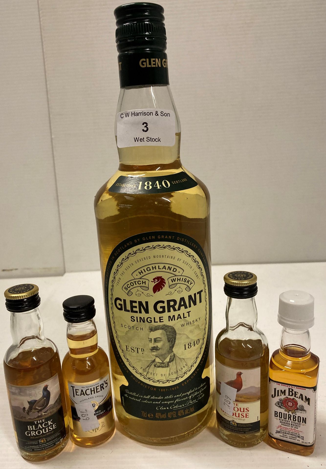 A 70cl bottle of Glen Grant single malt whisky and 4 x miniature bottles of assorted whiskies -