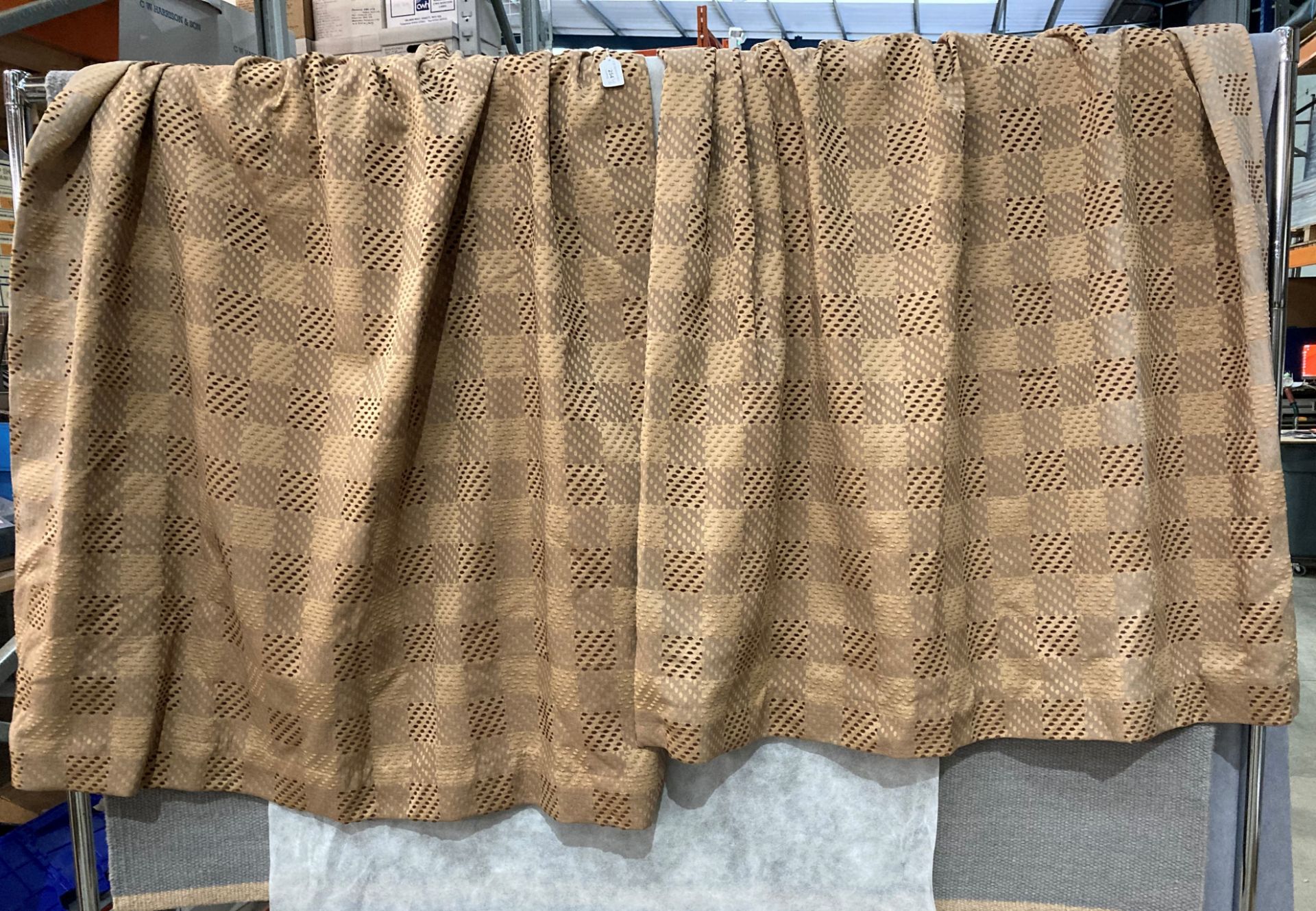 One pair of brown patterned heavy curtains fully lined with drawn tops each curtain 130cm x 120cm