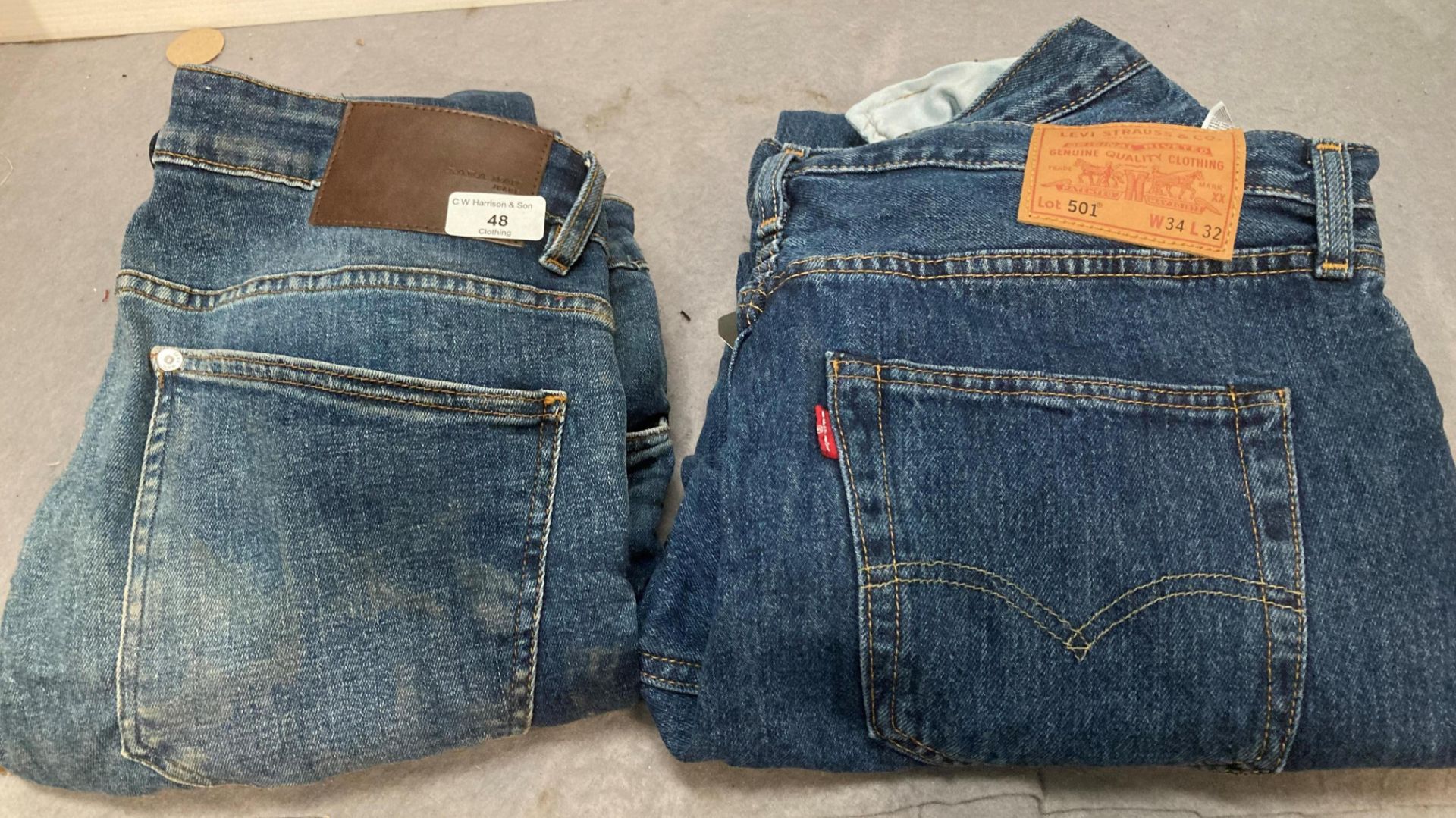 A pair of Levi 501 worn jeans W34 and L32,