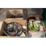 Contents to three boxes - two steering wheels, car head lamp, vintage plastic oil jugs,