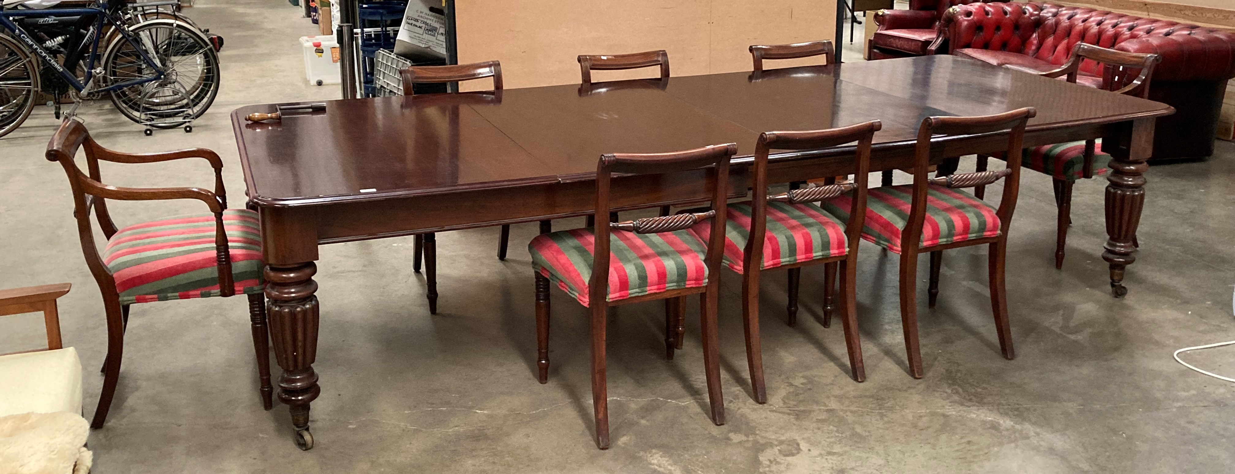 A Victorian mahogany extending dining table with two extra leaves on turned shaped legs