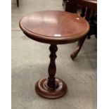 A mahogany circular side table on centre column support 50cm diameter - scratched to top
