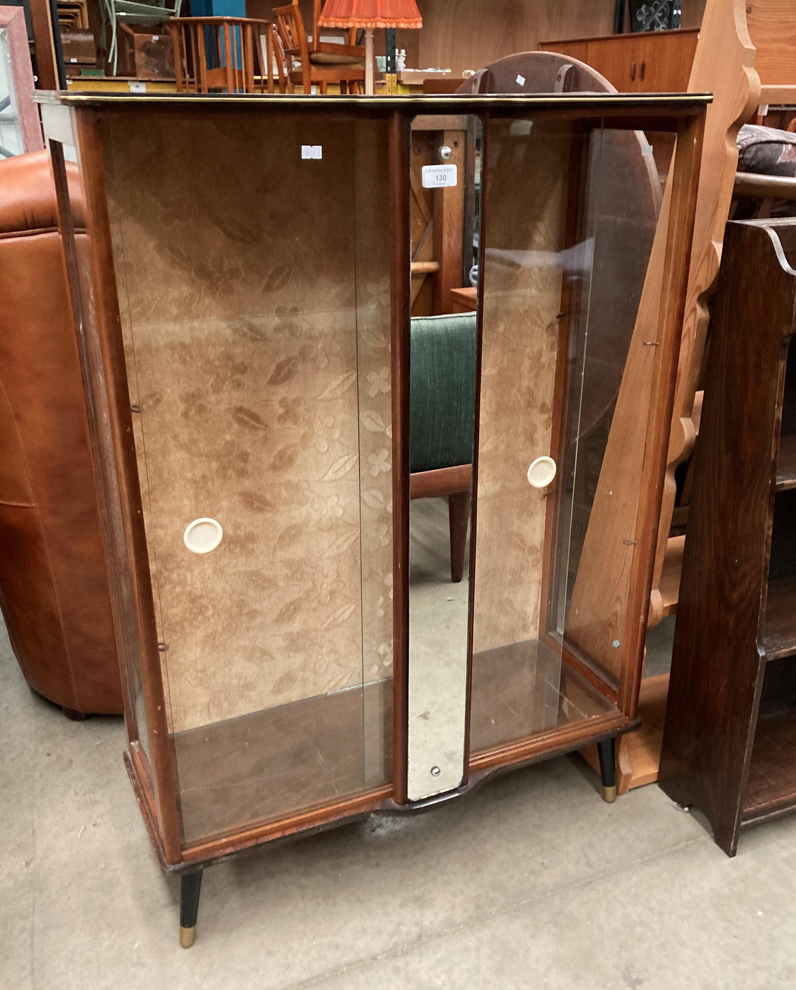 A small walnut display cabinet with sliding glazed doors 76cm x 107cm high