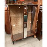 A small walnut display cabinet with sliding glazed doors 76cm x 107cm high