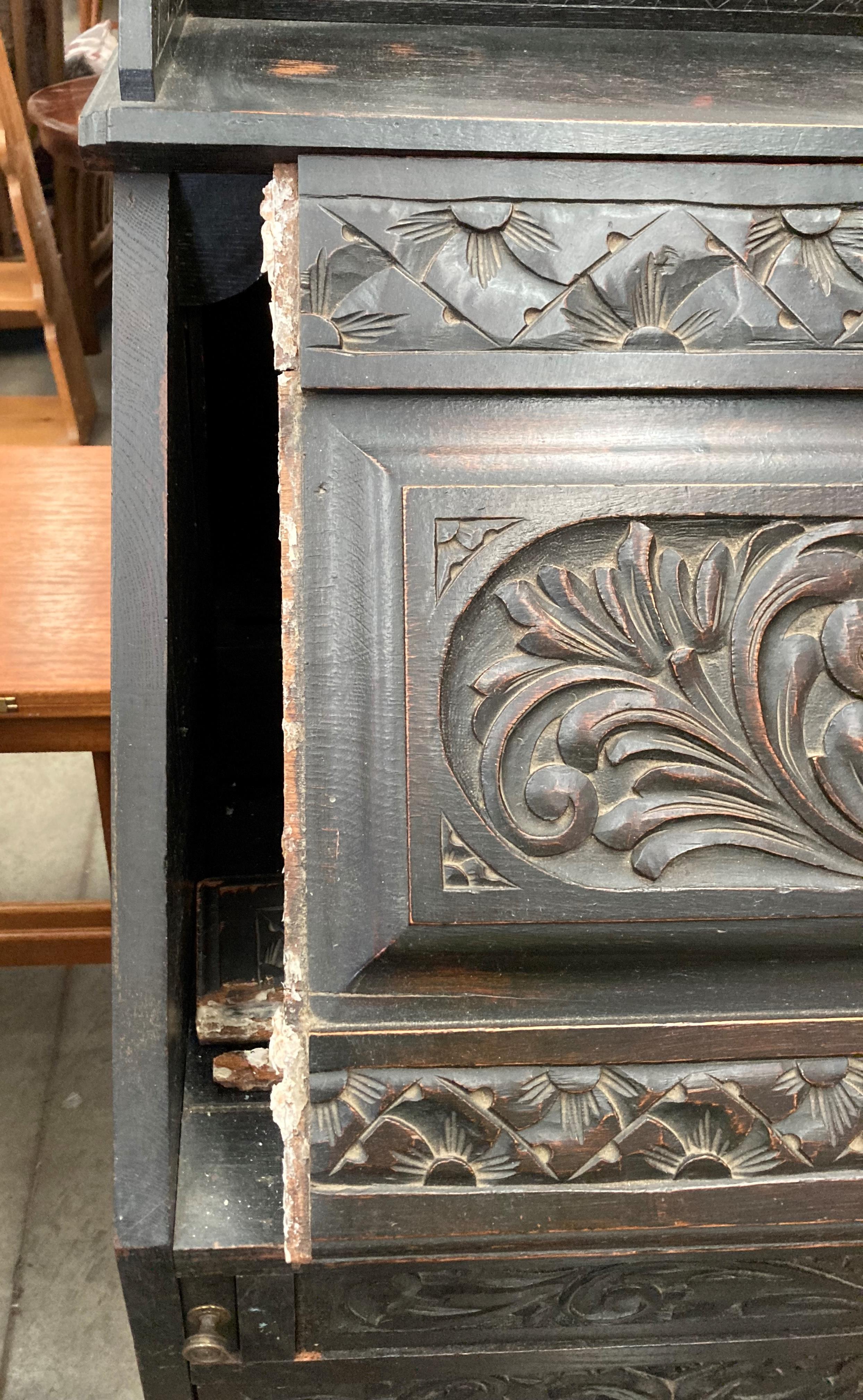 A carved oak bureau with fall flap over four drawer single door base 96cm x 114cm high (part of - Image 7 of 7