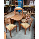 An oak folding top dining table 90cm x 120cm (when open) together with four dining chairs with