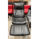 A black leather and grey metal framed recliner chair with ottoman by Kebb A/S, Hornslet, Denmark,