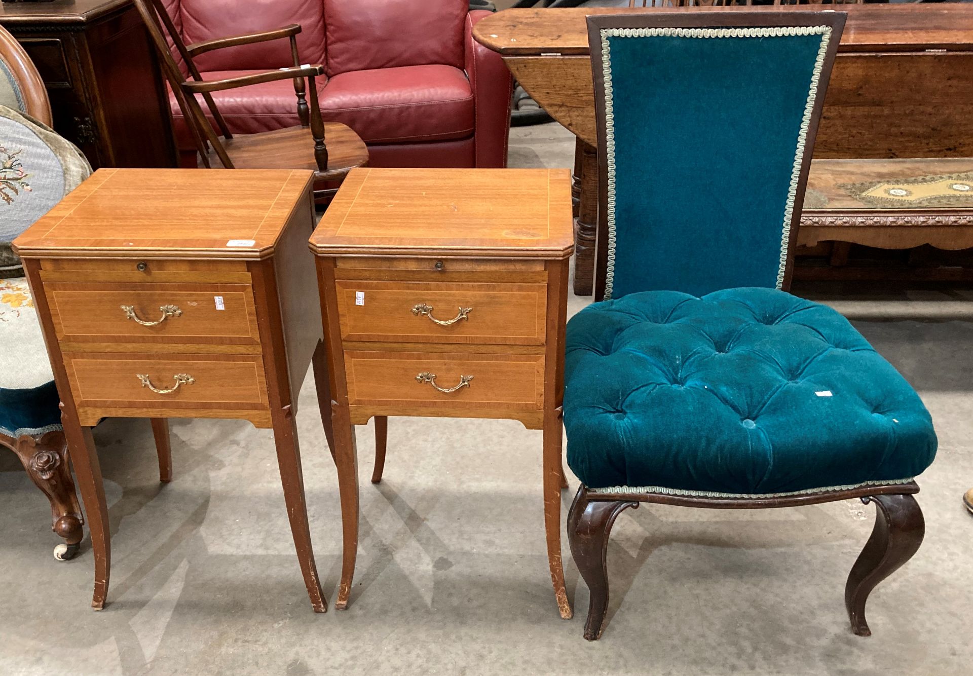 A pair of mahogany two drawer single slide leaf bedside cabinets, on tapered feet,