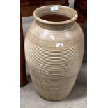 A brown glazed terracotta garden pot,