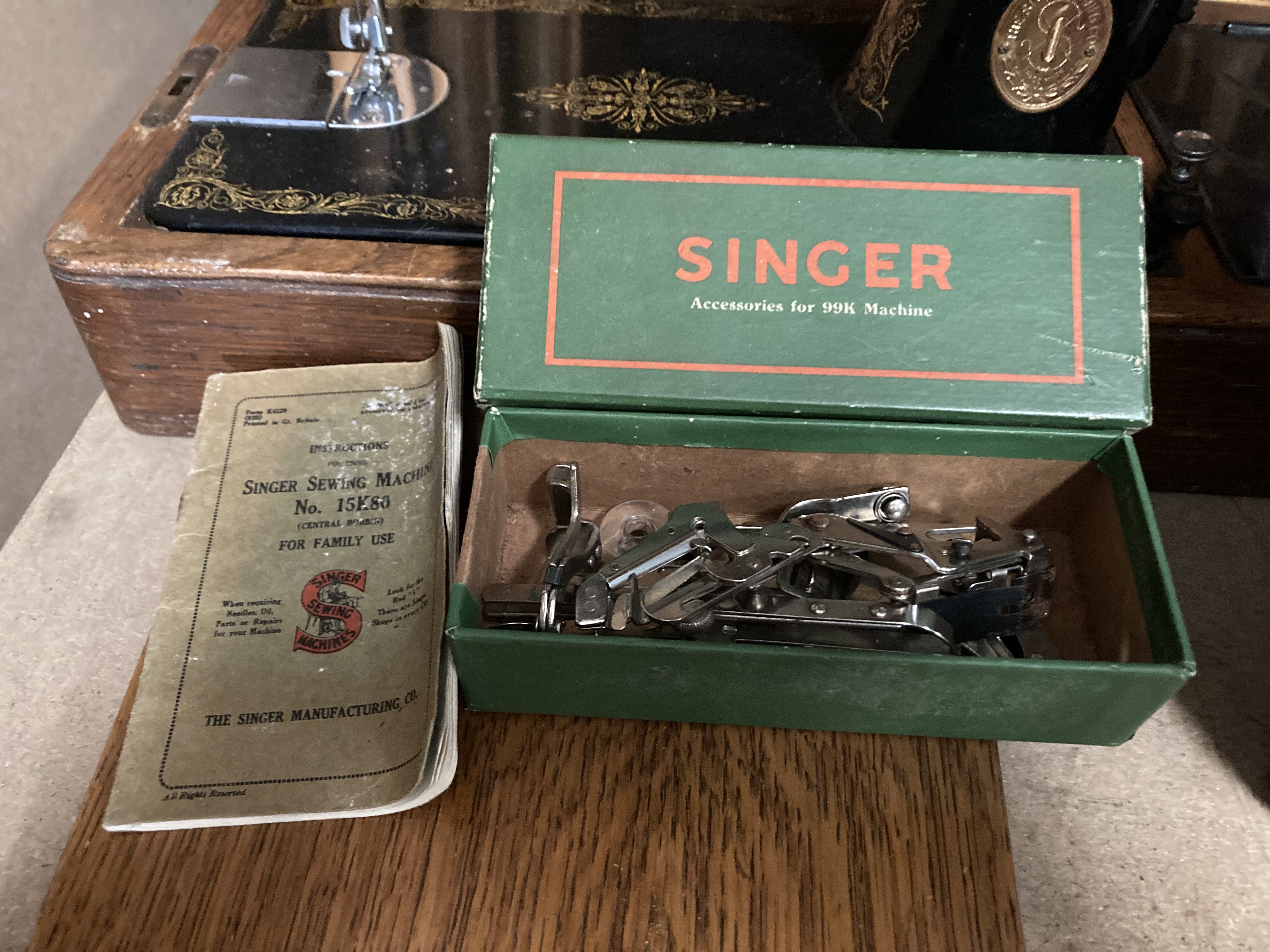A Singer sewing machine in oak finish portable case complete with accessory pack for a Singer 99K - Image 2 of 2