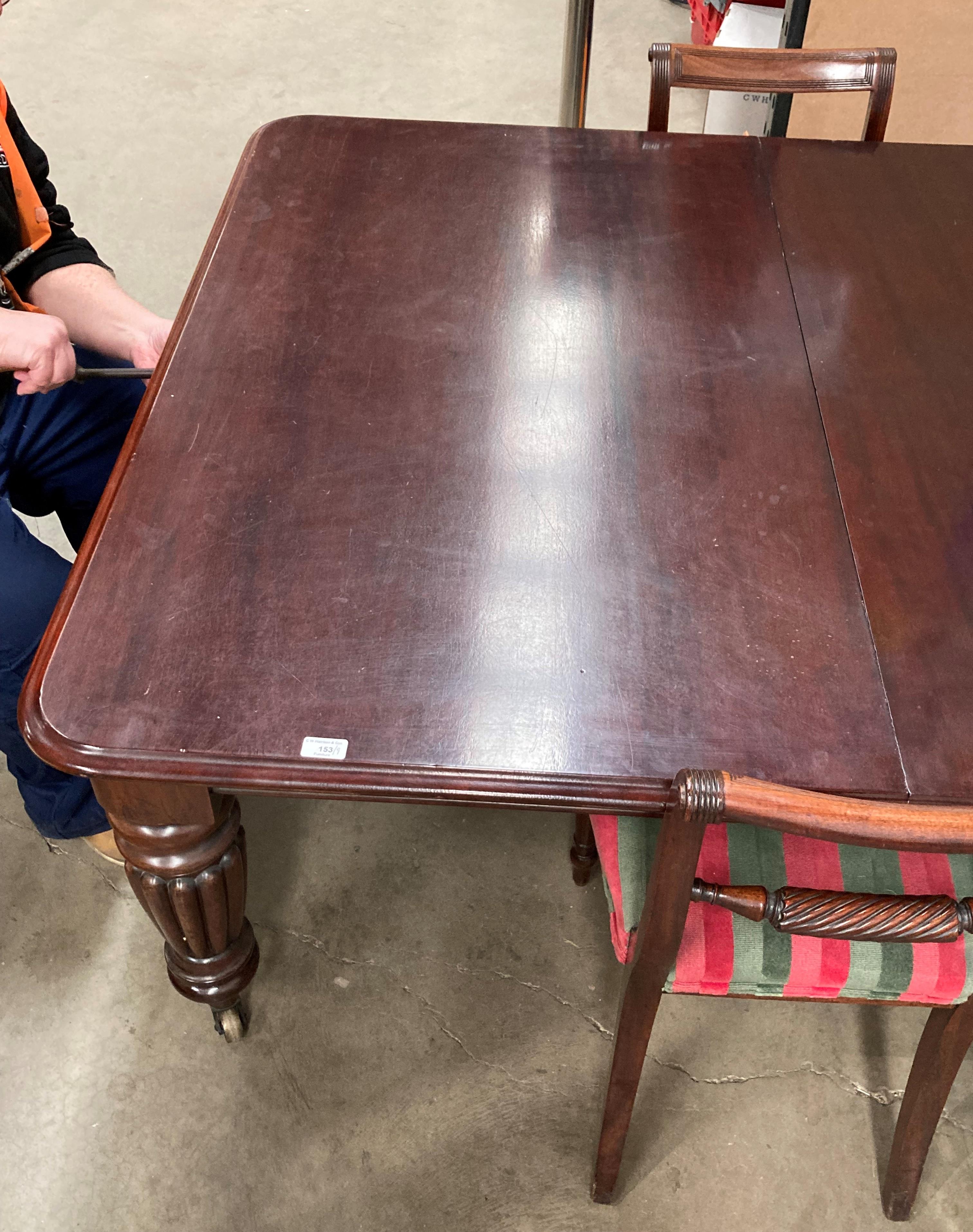 A Victorian mahogany extending dining table with two extra leaves on turned shaped legs - Image 12 of 14