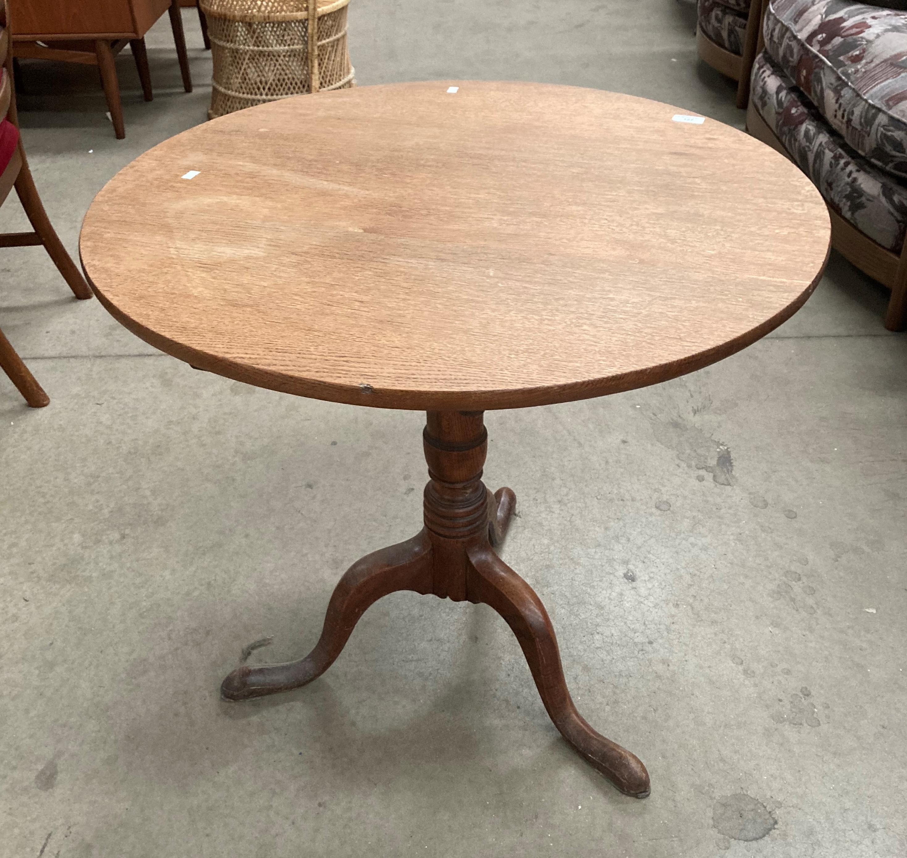 A George III oak tilt top tripod table with circular top 78cm diameter