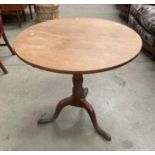 A George III oak tilt top tripod table with circular top 78cm diameter