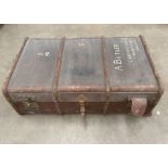 A wood framed brown fibre upholstered trunk initialled A Butler,