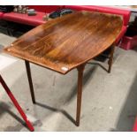 A varnished oak boat shaped dining table,